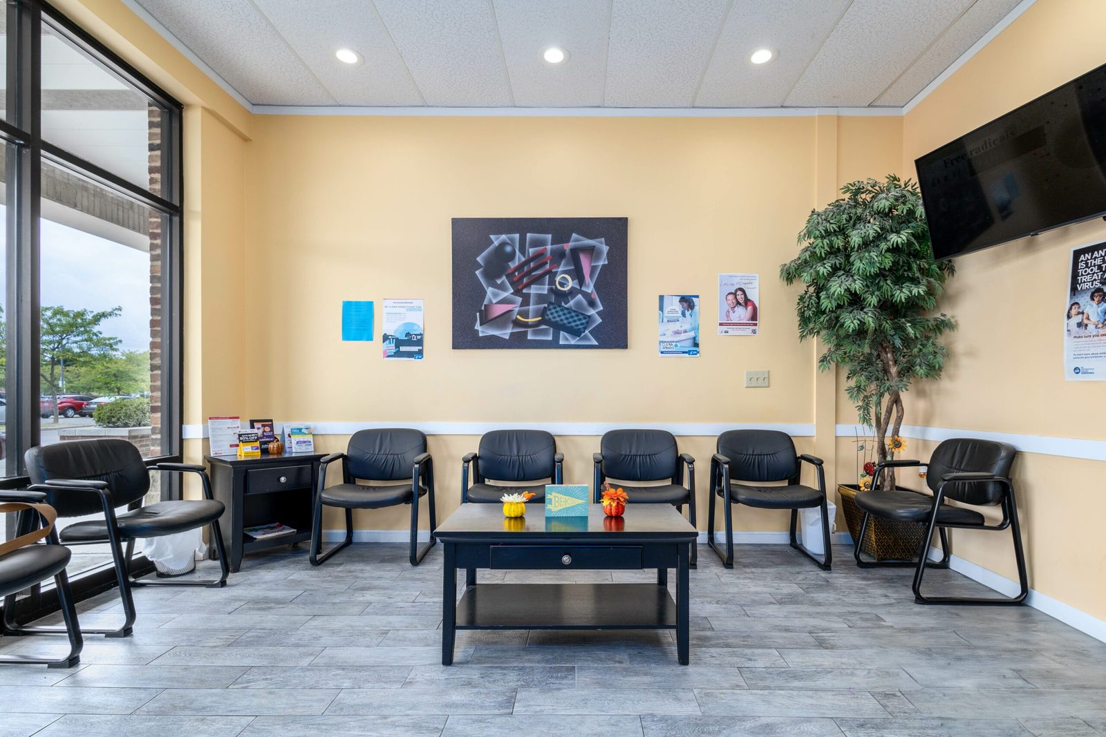 The waiting room at Superior Urgent Care, with seating and a television